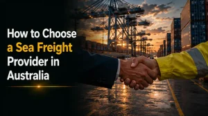 Business handshake in front of sea freight port cranes and shipping containers